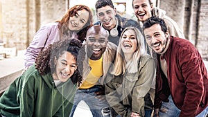 Happy group of friends hanging outside on city street