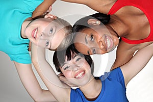 Happy group huddle by mixed race student girls photo