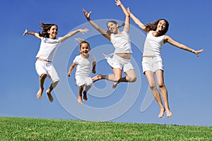 Happy group jumping at summer camp