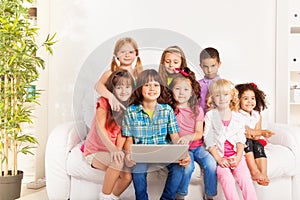 Happy group of kids with laptop