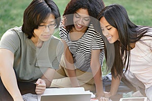 Happy group of multiethnic students studying