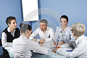 Happy group of people having conversation