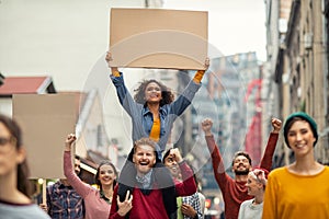 Happy group of people holding blank banner during strike