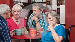 Happy Group of Seniors in a Bistro