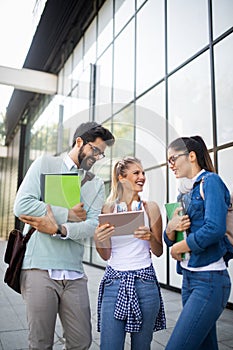 Happy group of students studying and learning together in college