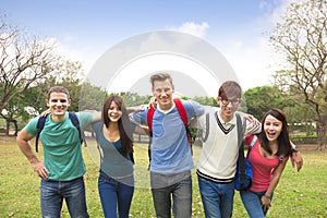 Happy group of students walking together