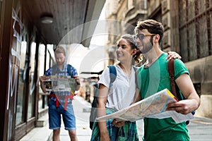 Happy group of tourists traveling and sightseeing