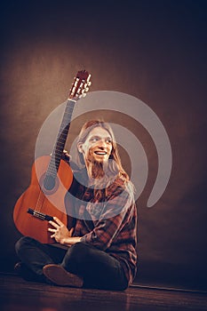 Happy guitarist and guitar.