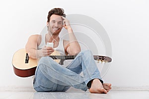 Happy guitarist with headset