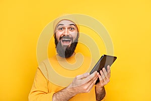 Happy guy with modern tablet