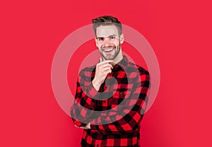 Happy guy smiling. portrait of fashionable handsome man in shirt. business classic mens shirts with checkered print photo