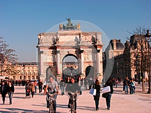 Happy guys on bicycle around Louvre, Paris