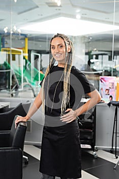 happy hairdresser, woman with braids in