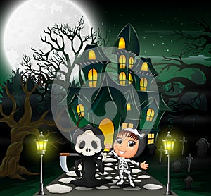 Happy halloween costume kid in front of the haunted house with full moon background