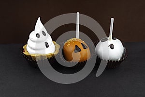 Happy Halloween cupcakes decorated with cream and chocolate