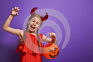 Little devil with a pumpkin