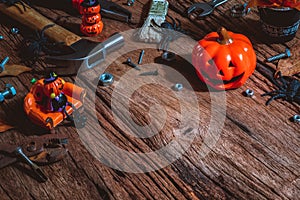 Happy Halloween day with construction DIY handy tools on rusty wooden background concept with copy space