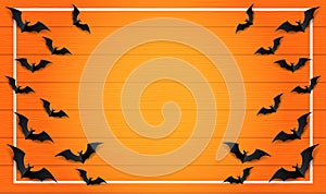 Happy Halloween . Design with paper art bats on orange wood background