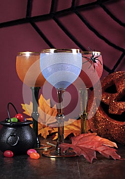 Happy Halloween ghoulish party cocktail drinks with color goblets photo