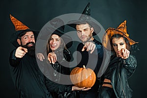 Happy Halloween. Happy friends celebrating Halloween. Close up Halloween portrait of funny group. Surprised group of