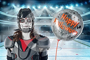 Happy halloween. hockey player in a hockey helmet and mask with a balloon against the backdrop or background of a hockey field. Al