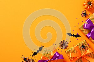 Happy Halloween holiday concept. Halloween banner design with gift boxes, spiders, webs, confetti on orange background
