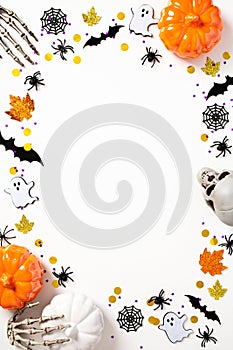 Happy Halloween holiday concept. Halloween poster design. Frame made of Halloween decorations, pumpkins, bats, spiders, webs,