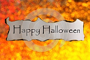 Happy Halloween-a holiday of evil spirits, the inscription on the background of bokeh lights. Halloween is the main holiday of photo
