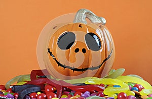 Happy Halloween Jack-o-Lantern pumpkin on top of candy