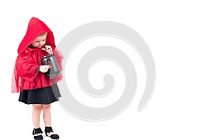 Halloween. Little Red Riding Hood. Beautiful little girl in a red raincoat.