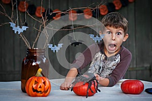 Happy Halloween. preschool boy is having fun, shouting, making faces. Trick-or-treating. Holiday party. October day