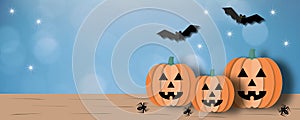 Happy Halloween with pumpkin and monster on blue bokeh background, Halloween illustration. photo