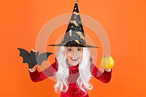 Happy halloween. smiling little girl halloween party. devil inside. spooky witch. jack o lantern. small child witch hat