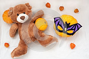 Happy halloween with soft toy teddy bear and pumpkin