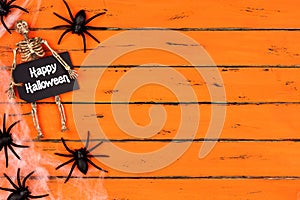 Happy Halloween tag with spider web side border on orange wood