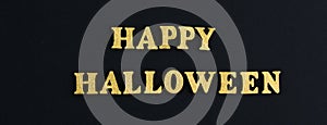 Happy Halloween text holiday concept. Black spiders over black background