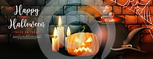 Happy halloween witch`s magic poison pot and hat candle pumpkin lantern with vintage retro brick wall background