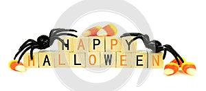 Happy Halloween wooden blocks with candy and decor over white