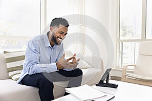 Happy handsome African student man talking to teacher