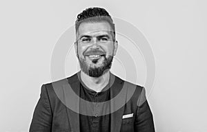 happy handsome businessman man with beard and bristle on unshaven face wearing stylish formal casual business jacket