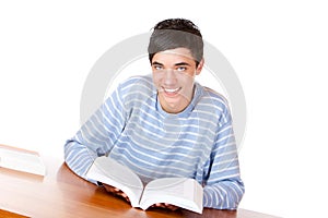 Happy handsome male student reading study book