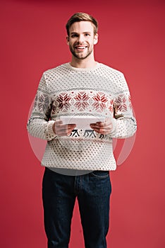 happy handsome man in winter sweater
