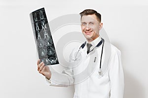 Happy handsome young doctor man holds x-ray radiographic image ct scan mri isolated on white background. Male doctor in