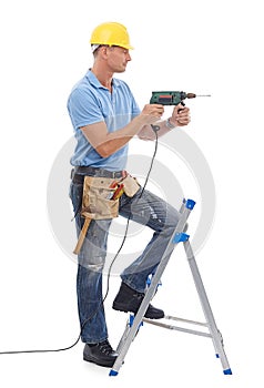 Happy, handyman and repairman in studio with a drill, tool belt and ladder for maintenance. Happy, smile and