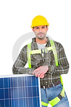 Happy handyman with solar panel