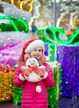 Happy happy laughing child girl with christmas present. Christmas concept