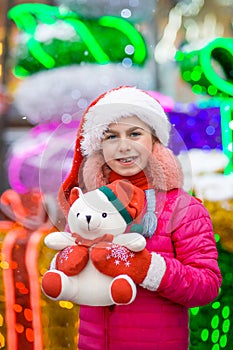 Happy happy laughing child girl with christmas present. Christmas concept