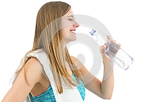 Happy healthy fitness woman drinking water
