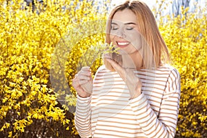 Happy healthy woman enjoying springtime outdoors