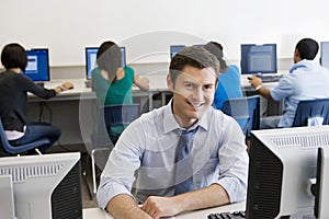 Happy High School Teacher In Computer Lab